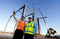Project Directors Lee Price (Urban Superway) and Luigi Rossi (Department of Infrastructure and Transport) at the initial construction of the Casting Yard shed 